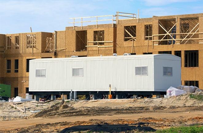 crane lifting modular building for construction office rentals in Boca Grande FL